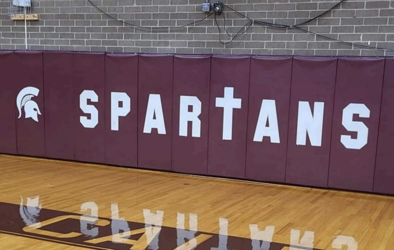 School Ordered to Remove Cross From Mascot Logo